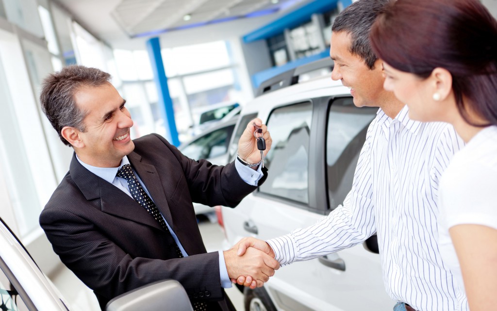 Happy-Car-Salesman-closing-deal